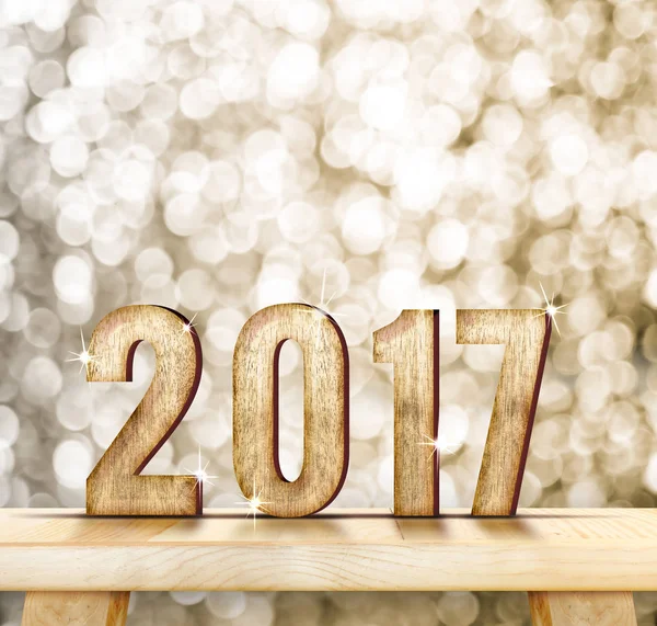 2017 year wood number on wood table with gold sparkling bokeh wa — Stock Photo, Image