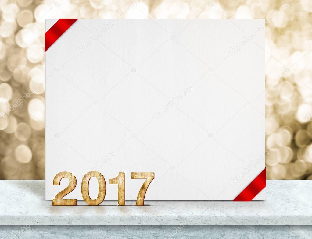 2017 year wood number and white card with red ribbon in perspect