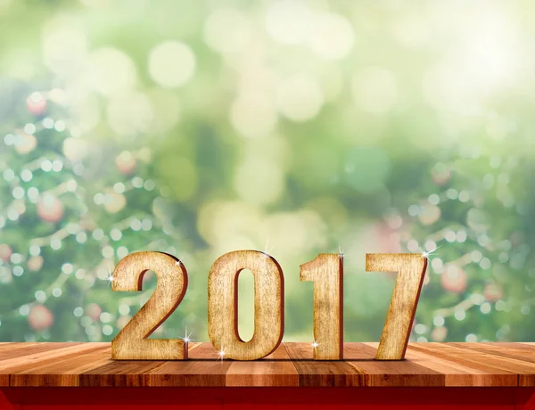 New year 2017 red text (3d rendering) hanging over wood plank ta — Stock Photo, Image