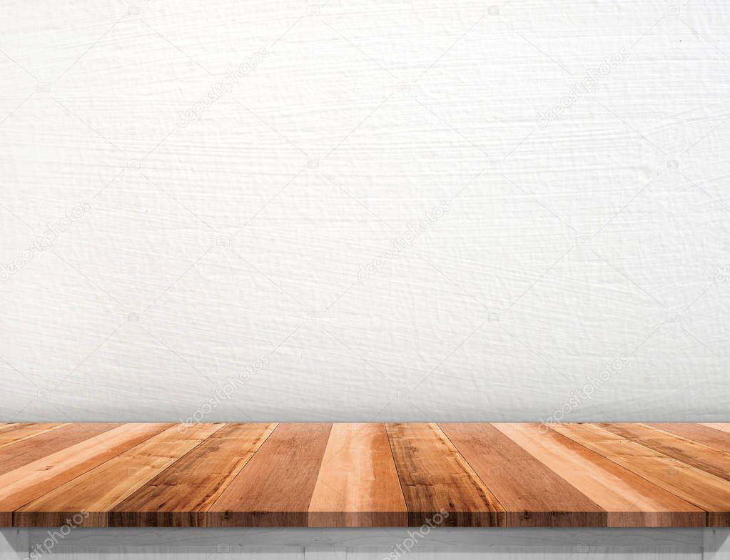 Empty brown wood table top with white concrete wall,Mock up for 