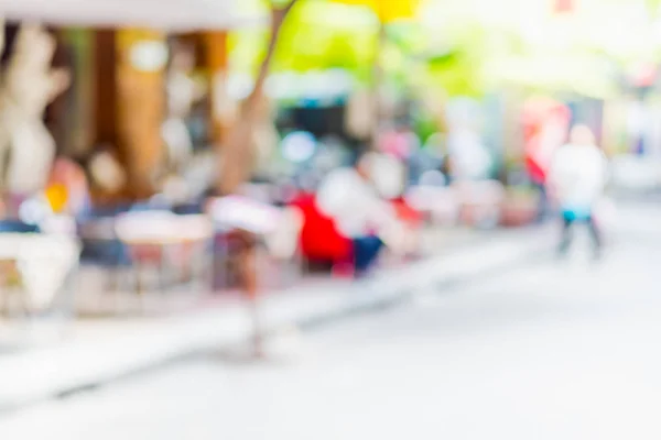 Fondo borroso: las personas que compran en la feria del mercado en un día soleado — Foto de Stock