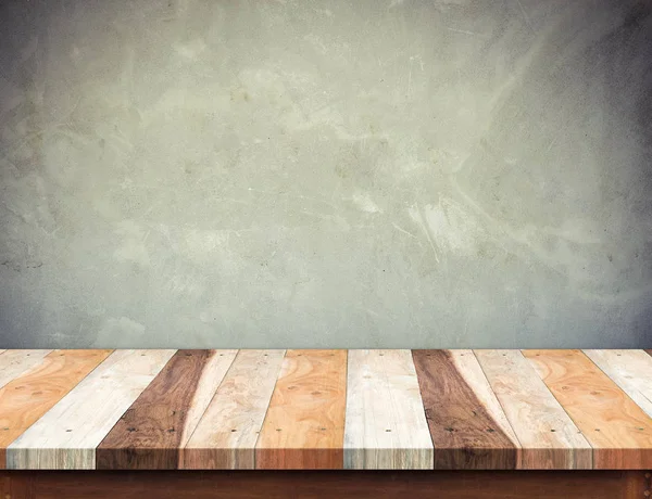Tavolino in legno vuoto con muro in cemento grunge, Finto per — Foto Stock