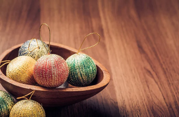 Christmas decoration balls on wooden table top,winter holiday st