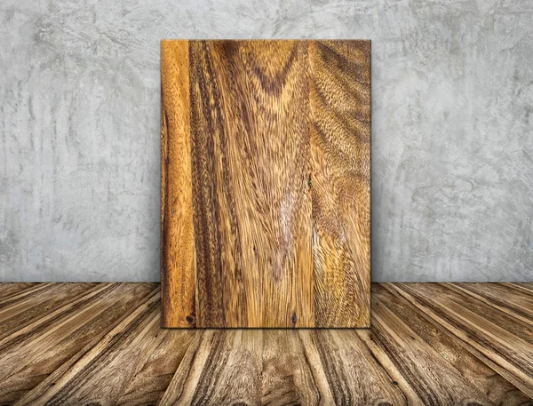 Puste drewniane ramki zwykły opierając się o betonową ścianę na drewnianej podłodze — Zdjęcie stockowe