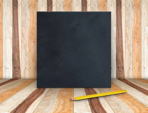 Blank black fabric poster canvas with yellow pencil at wooden pl — Stock Photo, Image