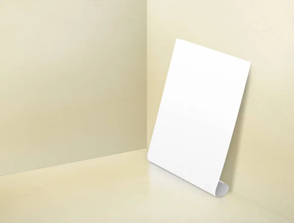 Blank white rolling poster at corner painted pastel yellow color — Stock Photo, Image