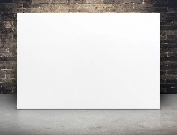 Blank white paper poster at grunge brick wall and concrete floor — Stock Photo, Image