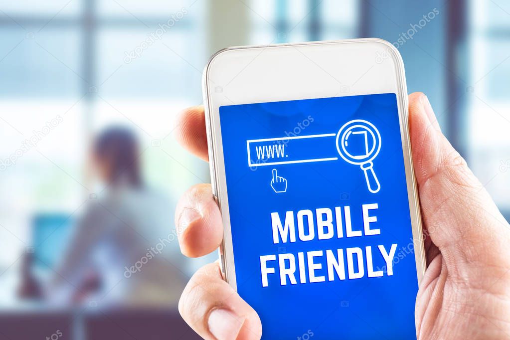 Hand holding mobile with Mobile Friendly and search icon feature