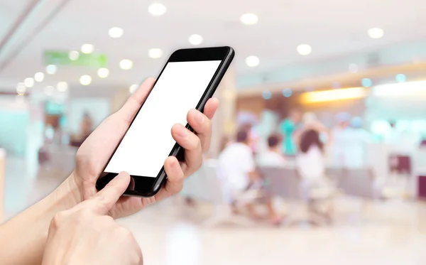 Hand click mobile phone with blur patient at hospital background — Stock Photo, Image