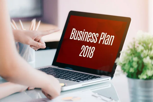 Business people meeting in front of laptop computer screen with — Stock Photo, Image