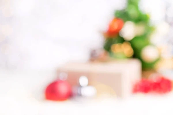 Blur christmas tree and gift box and decoration ball on white sn — Stock Photo, Image