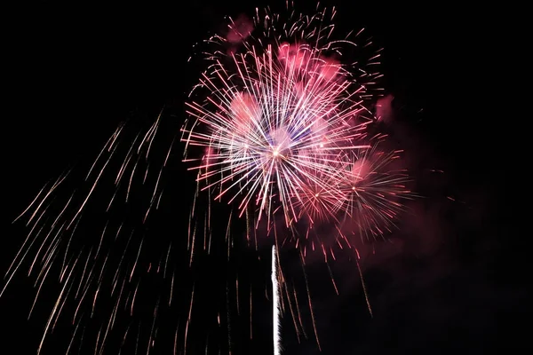 Firework blast in dark sky at night celebration new year,count d