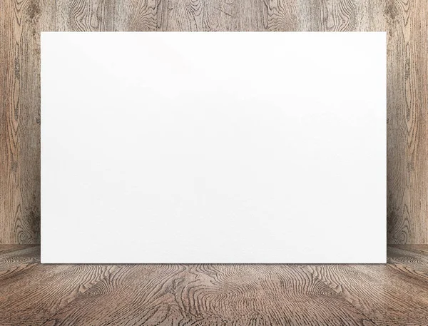 Blank banner white paper poster leaning at wood wall on wooden f — Stock Photo, Image