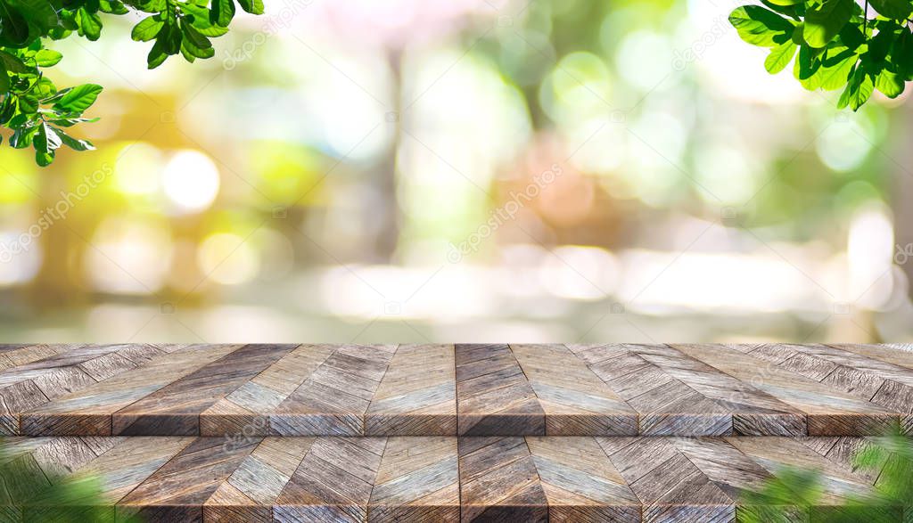 Empty step plank wood table top with blur tree in park with boke