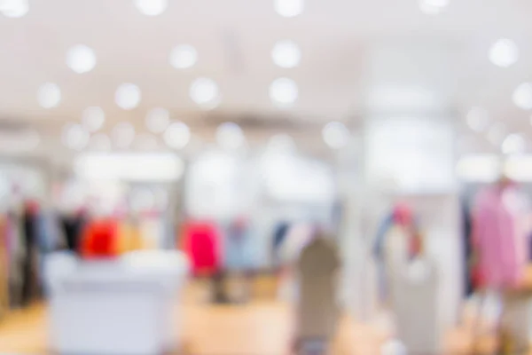 Blur shopping center bokeh fundo de luz, prateleira do produto em depar — Fotografia de Stock