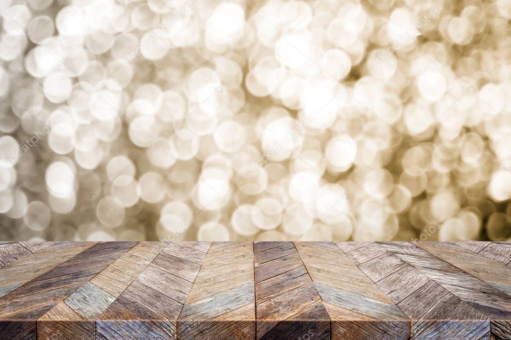 Empty old rustic wood table top with blur sparkling gold bokeh a