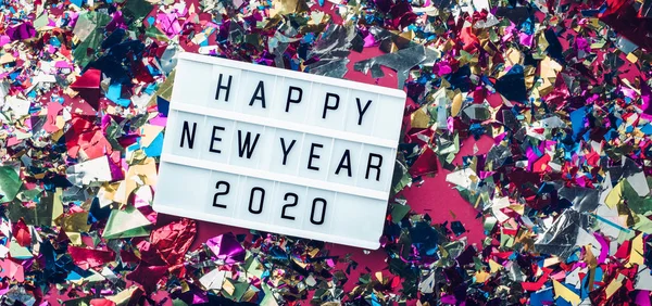 2017 년 6 월 24 일에 확인 함 . Happy New Year 2020 Lightbox on colorful confetti background. top — 스톡 사진