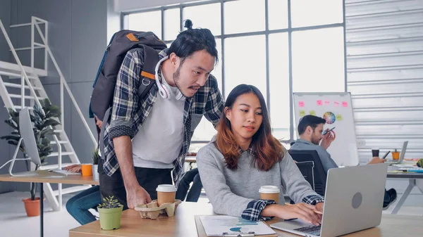 Two of creative designer casual talking at morning with laptop a — Stockfoto