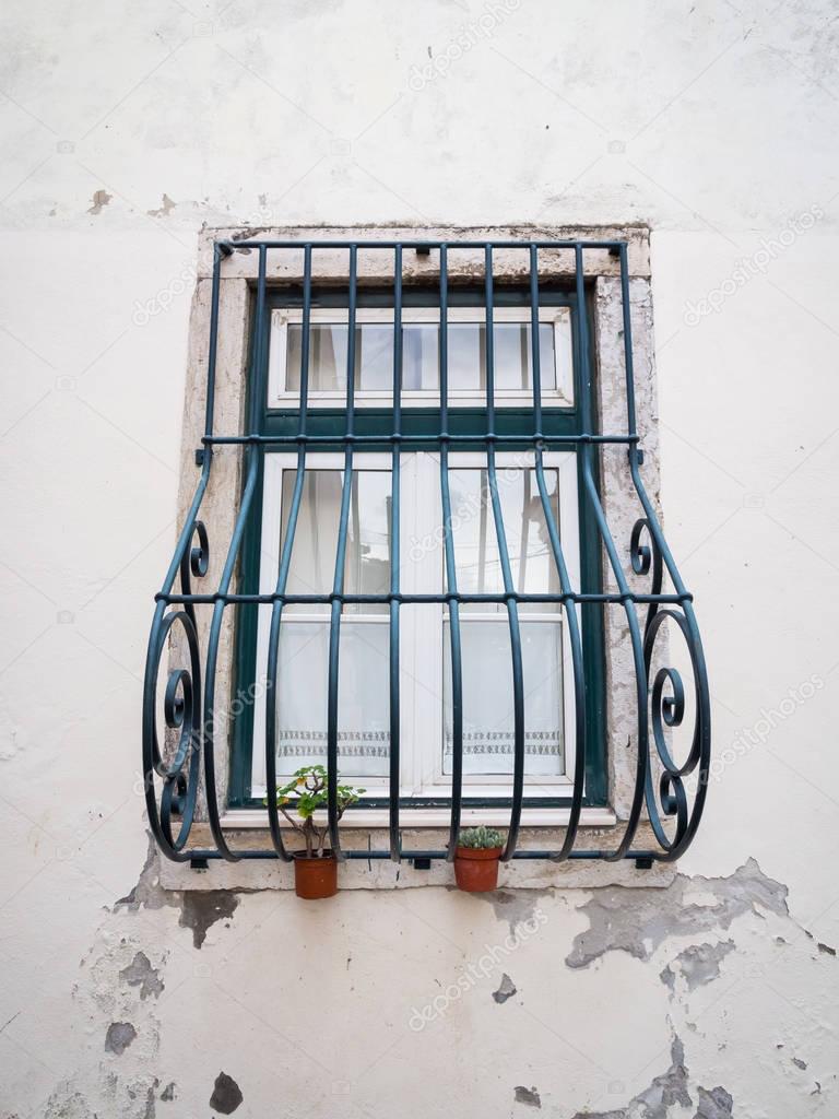 window with black burglar bar