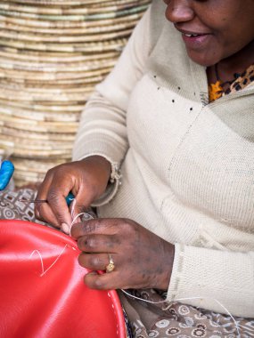 Ethiopian woman makes Habesha baskets clipart