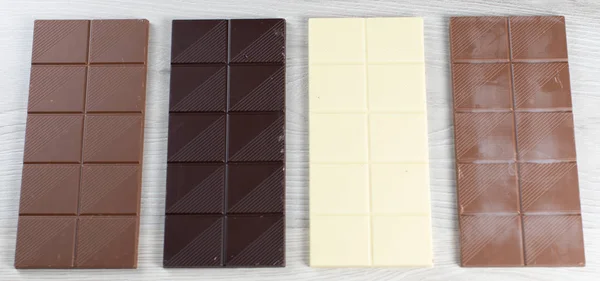 Delicious White Black Hazelnut Milk Chocolate Flavored Chocolate Tablets — Stock Photo, Image