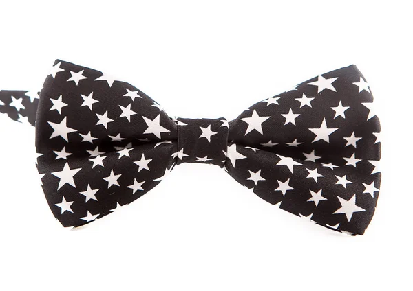 Corbata de lazo negro con estrellas blancas sobre fondo blanco, agradable para la fiesta, año nuevo —  Fotos de Stock