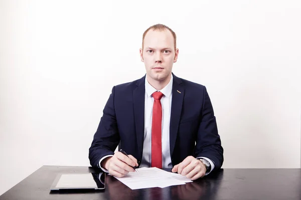 Young lawyer business man working with paperwork on his desk in office workplace, consultant lawyer concept in front of white background