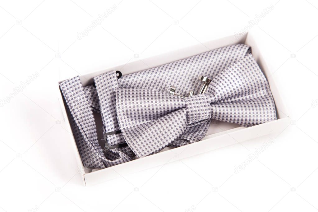 bow tie and cufflinks. the preparations of the groom and details of the wedding day isolate on white background