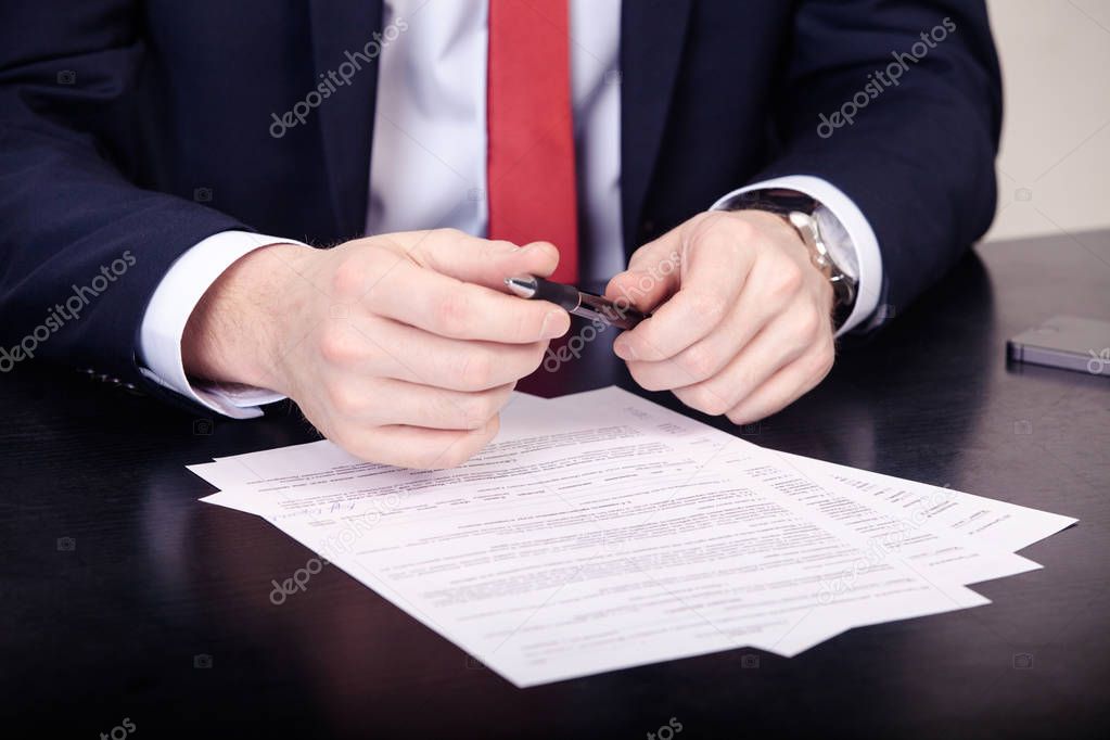 Business agreement signing, businesswoman handwriting signature on contract document at office desk