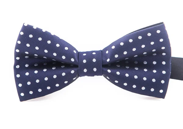 Dotted bow tie white with dark blue spots, close up, on white background Stock Image