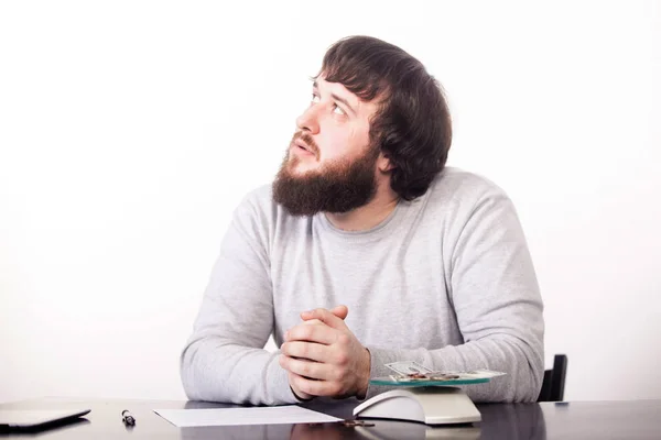 Thoughtful handsome young manager with folded hands, thinking about planning on the next year — Stock Photo, Image