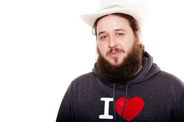 Bearded man in a hat look straight on the bright background — Stock Photo, Image