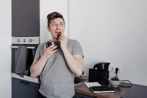 stock image man works remotely at home and seizes stress