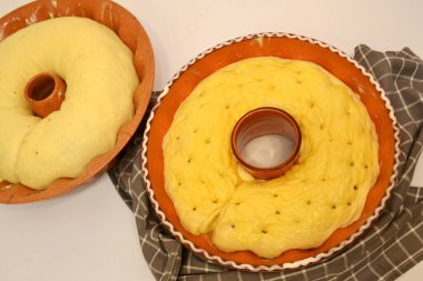 Fresh, fermented, ready to bake potica, traditional Slovenian festive dessert; babka/almond roll in baking mold 