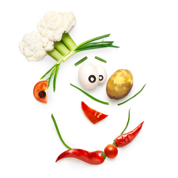 Veggie chef. Creative food concept of a funny cartoon chef face made of vegetables isolated on white. — Stock Image Veggie chef. Creative food concept of a funny cartoon chef face made of vegetables isolated on white. Royalty Free Stock Photos