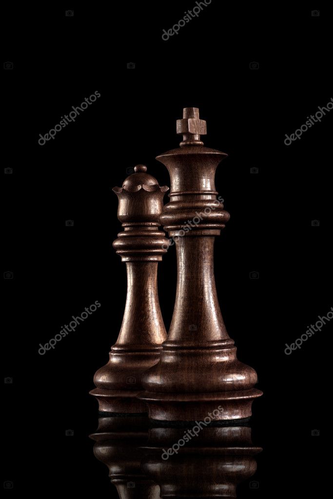 Powerful figures. Chess game concept of black wooden king and