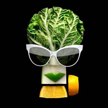 Tasty art. Quirky food concept of cubist style female face in sunglasses made of fresh fruits on black background. clipart