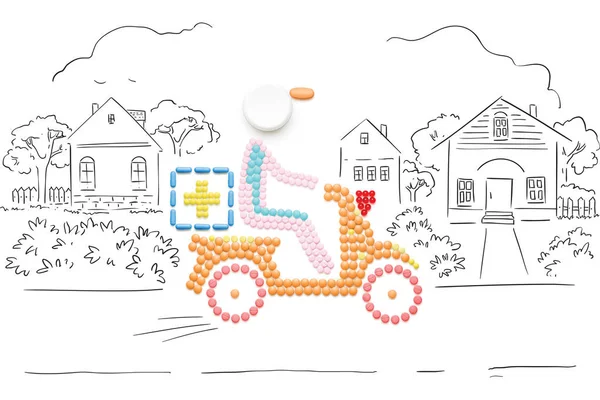 Help in road. Creative medicine and healthcare concept made of pills, drugs motorbike delivery, on sketchy country background. — Stock Photo, Image