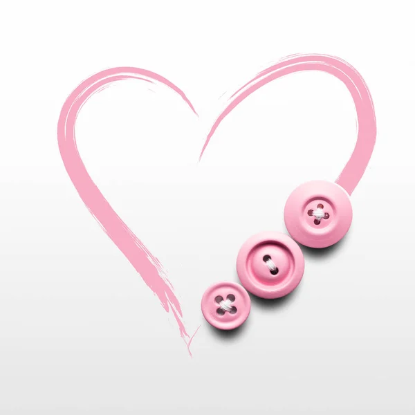 Sewing hard. Creative valentines concept photo of buttons and illustrated heart on white background. — Stock Photo, Image