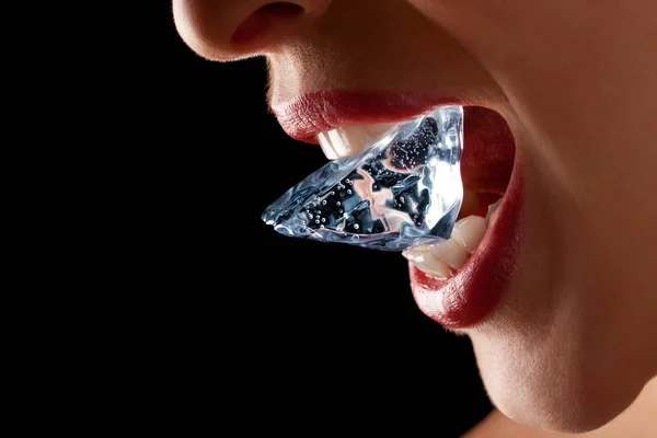 Ice cube in woman's mouth. — Stock Photo, Image