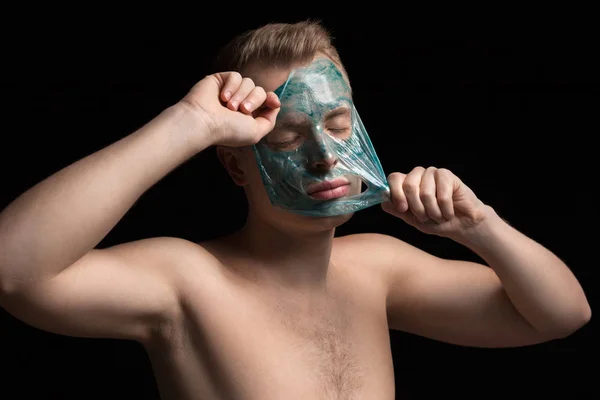 Man with cleaning clay facial mask — Stock Photo, Image