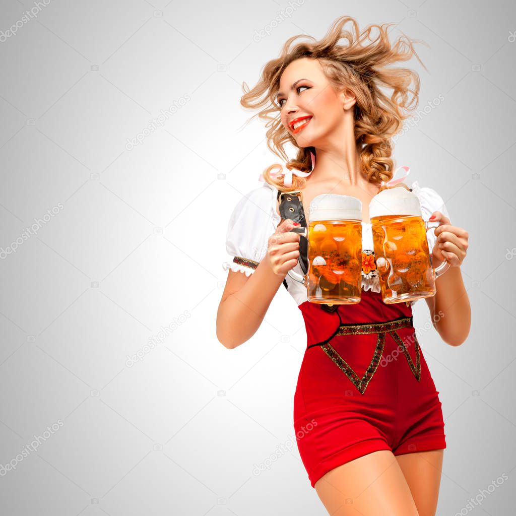 Beautiful woman serving beer mugs
