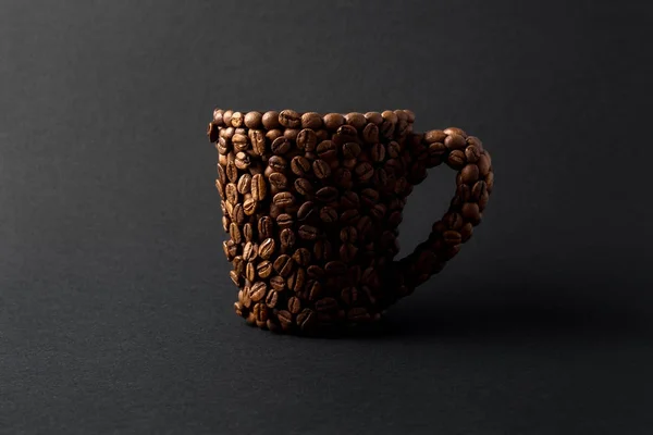 Coffee cup. Creative concept photo of a cup made of coffee on black background. — Stock Photo, Image