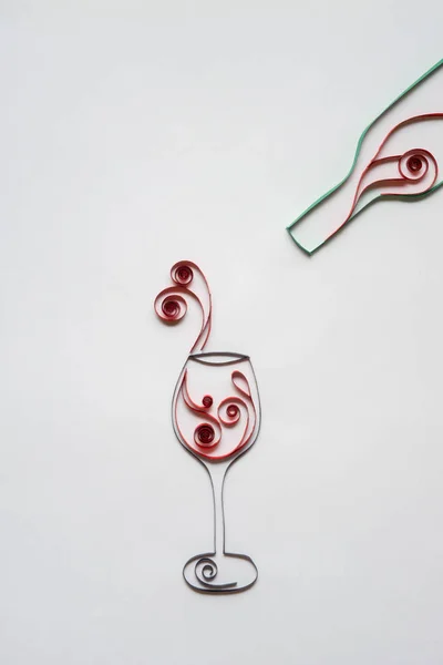 Wineglass. Creative concept photo of glass and bottle with win mad of paper on white background. — Stock Photo, Image