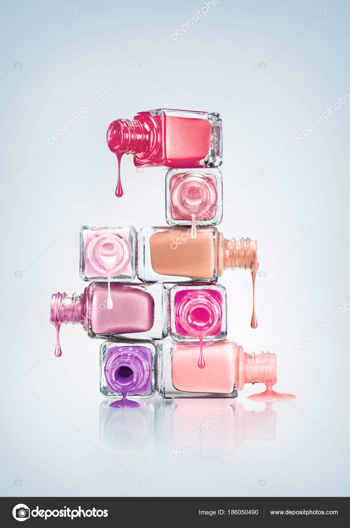 Colored Nail Polish Dripping From Stacked Bottles On Dark Background  High-Res Stock Photo - Getty Images