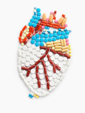 Drugs and pills in the shape of a human heart. clipart