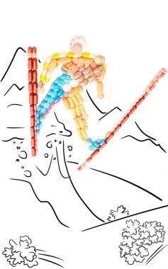 Doping pills in the shape of a professional skier in jump from a mountain. clipart