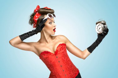 The conceptual photo of a pin-up girl in glamour underwear and gloves watching at the clock. clipart