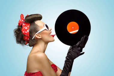 A photo of glamorous pin-up girl touching vinyl LP with tongue. clipart