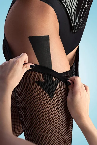 Beautiful Sexy Girl Taking Her Fishnet Pantyhose According Arrow Sign — Stock Photo, Image